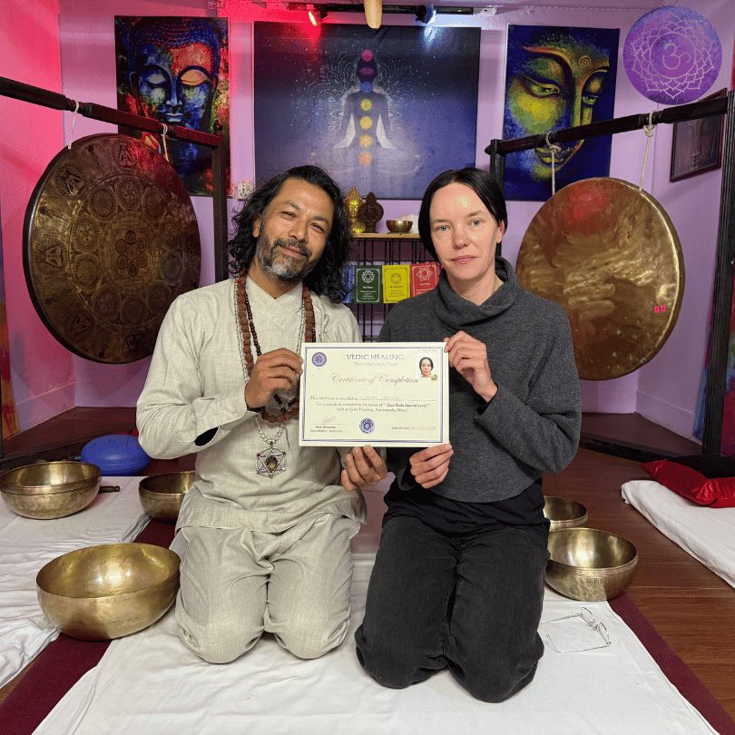 Graduate receiving a certificate with Master Amit